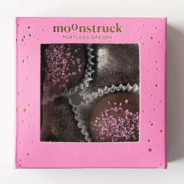 Pink box of chocolate truffles with glittery toppings