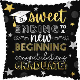 Graduation-themed decorative pillow with gold and white text on black background