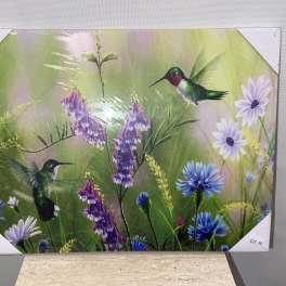 Decorative floral print with hummingbirds and purple-blue flowers