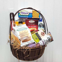 Basket of assorted packaged snacks and crackers