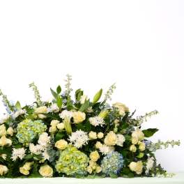 Our Gentle Thoughts Collection: Full Casket Spray in White and Blue