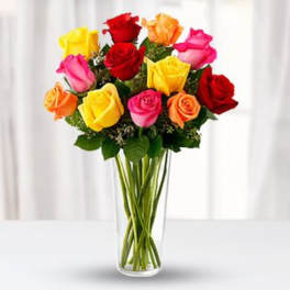 Bouquet of multicolored roses in a clear glass vase
