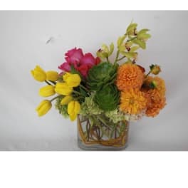 Colorful mixed bouquet in a clear glass vase