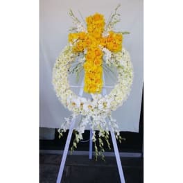 Yellow and white floral standing wreath on an easel