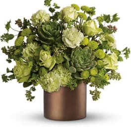 Green floral arrangement in a bronze vase with roses and succulents