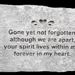 Memorial stone plaque with an engraved remembrance message