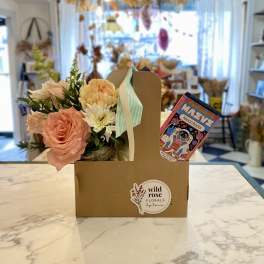 Small floral gift box with pastel flowers and a chocolate bar