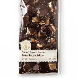 Wrapped chocolate bar with pecan brittle pieces