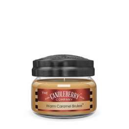 Jar candle labeled Warm Caramel Brulee