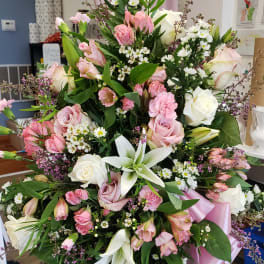 Large pink and white floral standing spray with ribbon
