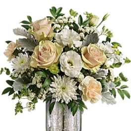 Cream roses and white daisies arranged in a silver vase