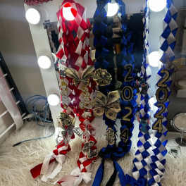 Decorative ribbon garlands with 2024 numbers and dollar-bill bows