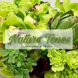 Green floral arrangement with orchids and carnations