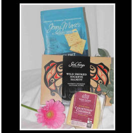 Gift basket with crackers, smoked salmon, cheese, and a pink gerbera daisy