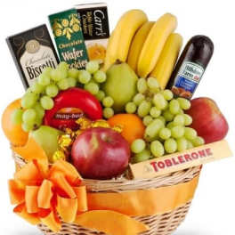 Fruit basket with bananas, grapes, apples, pears, and chocolates