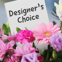 Pink and white mixed bouquet with a designer's choice sign