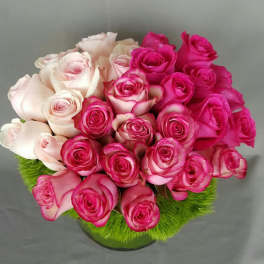 Bouquet of pink and pale blush roses in a round arrangement