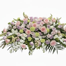 Low floral spray with pink and lavender roses and white blooms