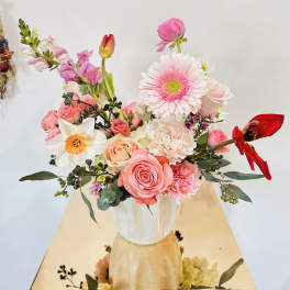 Pink and white mixed bouquet in a white vase