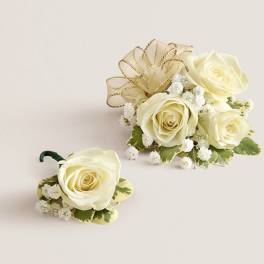 Cream rose boutonniere and matching floral piece with gold ribbon