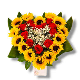 Heart-shaped bouquet of red roses and yellow sunflowers