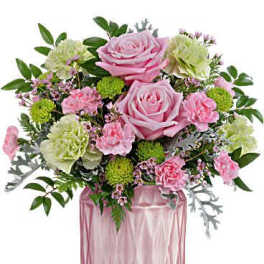 Pink roses and carnations in a pink glass vase