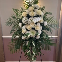 White rose and daisy standing spray on an easel