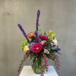 Colorful mixed bouquet in a clear glass vase