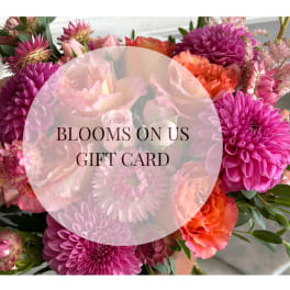 Gift card over a bouquet of pink, orange, and peach flowers