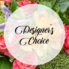Mixed bouquet of pink roses, yellow alstroemeria, and purple flowers with Designer's Choice text overlay