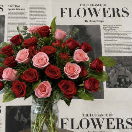 Bouquet of red and pink roses in a clear glass vase