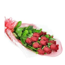 Bouquet of red roses wrapped in pink mesh