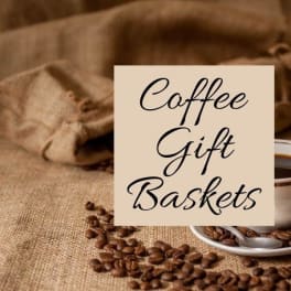 Coffee cup and saucer with coffee beans and a sign reading Coffee Gift Baskets