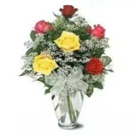 Bouquet of red and yellow roses in a clear glass vase