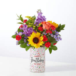Colorful mixed bouquet in a birthday vase