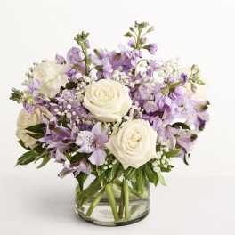 Lavender and white bouquet in a clear glass vase