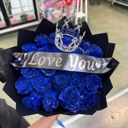 Bouquet of blue roses with a crown and "I Love You" ribbon
