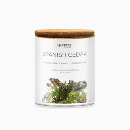 Scented candle in a glass jar with a wooden lid