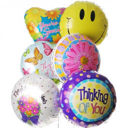 Cluster of colorful foil balloons with floral prints and thank-you messages
