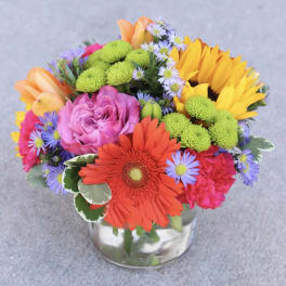 Colorful mixed bouquet in a clear glass vase