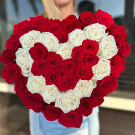 Heart-shaped bouquet of red and white roses