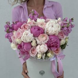 Large pink and white bouquet in a round white box