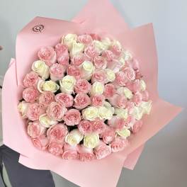 Large bouquet of pink and white roses wrapped in pink paper