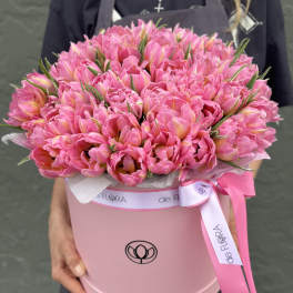 Large pink tulip bouquet in a round pink box with ribbon