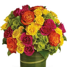 Colorful rose bouquet in a green glass vase