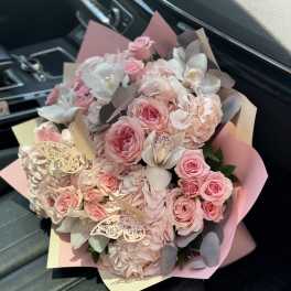 Pink roses and hydrangeas bouquet with white orchids and butterfly accents