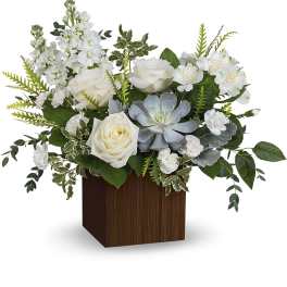 White roses and alstroemeria in a wooden cube vase with a succulent