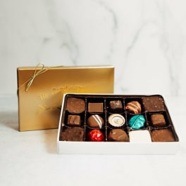 Box of assorted chocolates in a gold gift box