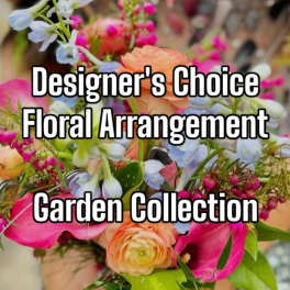 Mixed bouquet with peach and pink flowers and pale blue blooms