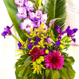 Tropical bouquet with purple orchids, pink chrysanthemums, and yellow filler flowers